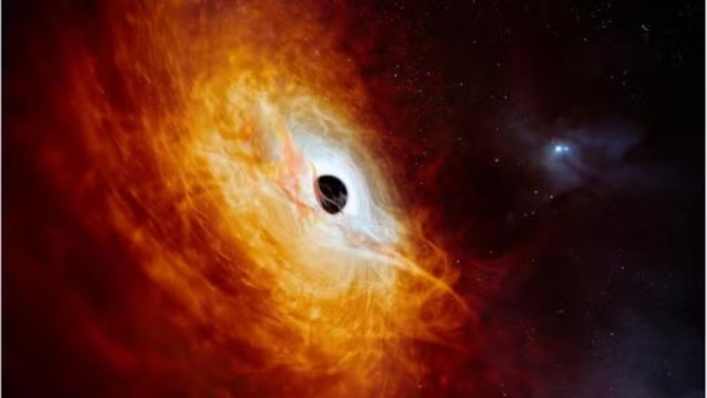 Cientistas Descobrem Objeto Mais Luminoso do Universo - Arte: O núcleo brilhante do J0529-4351 é alimentado por um buraco negro supermassivo — Foto: BBC